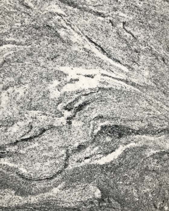 A full stone slab in the yard at Beautiful Granite & Marble