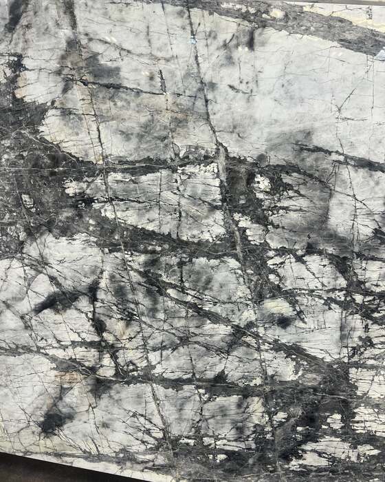 A full stone slab in the yard at Beautiful Granite & Marble