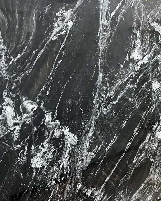 A full stone slab in the yard at Beautiful Granite & Marble