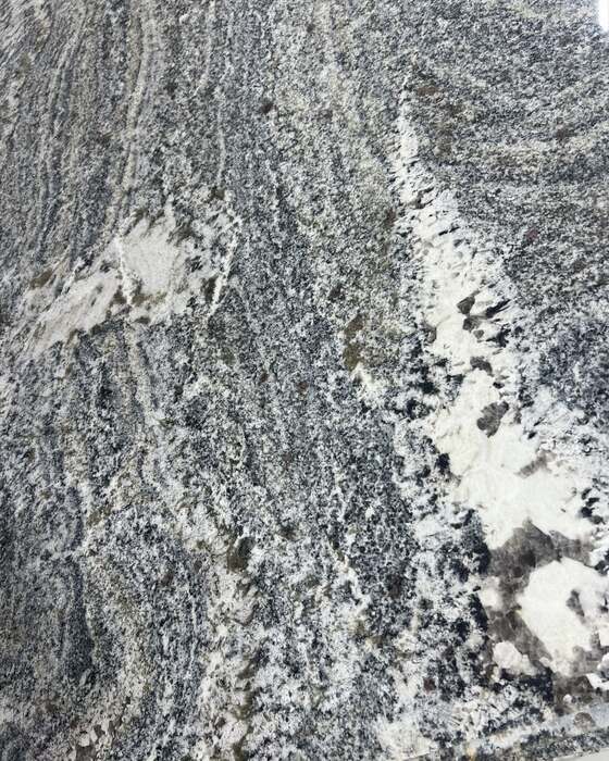 A full stone slab in the yard at Beautiful Granite & Marble