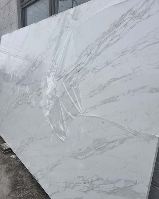 A full stone slab in the yard at Beautiful Granite & Marble