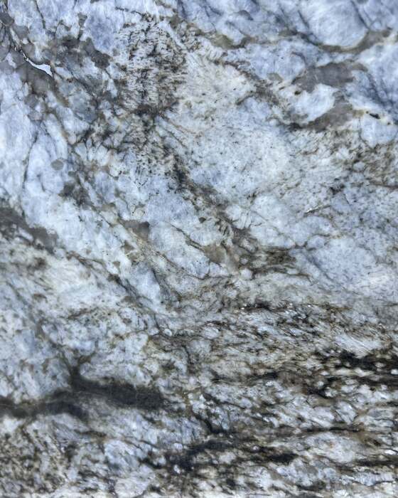 A full stone slab in the yard at Beautiful Granite & Marble