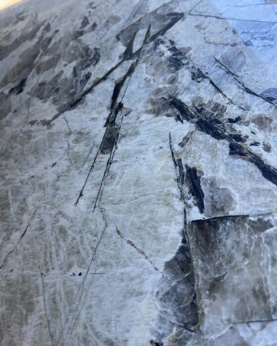 A full stone slab in the yard at Beautiful Granite & Marble